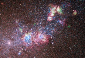 The dwarf galaxy NGC 4214 is ablaze with young stars and gas clouds. Located around 10 million light-years away, the galaxy's close proximity, combined with the wide variety of evolutionary stages among the stars, make it an ideal laboratory to research the triggers of star formation and evolution. Photo courtesy of NASA Image and Video Library