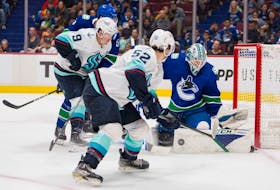 Vancouver Canucks goalie Thatcher Demko (35) blocks a shot against Seattle Kraken forward Ryan Donato (9) in the first period at Rogers Arena. 