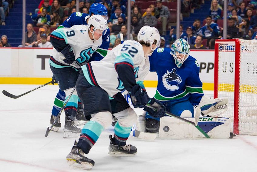 Vancouver Canucks goalie Thatcher Demko (35) blocks a shot against Seattle Kraken forward Ryan Donato (9) in the first period at Rogers Arena. 