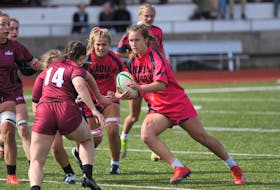 Acadia centre Sara Grant carries the ball during an Atlantic university women's rugby match against Saint Mary's on Sunday afternoon in Wolfville. Grant had a try and four conversions in the 58-12 win. - PETER OLESKEVICH / ACADIA ATHLETICS