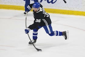 Maple Leafs defenceman Rasmus Sandin, skating with veteran Jake Muzzin, played his off side during practice on Sunday.