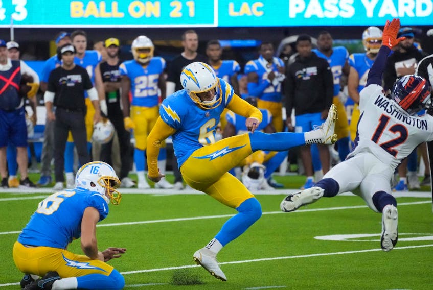 Oct 17, 2022; Inglewood, California, USA; Los Angeles Chargers place kicker Dustin Hopkins (6) kicks a 39-yard fielg goal out of the hold of punter JK Scott (16) in overtime against the Denver Broncos at SoFi Stadium.  