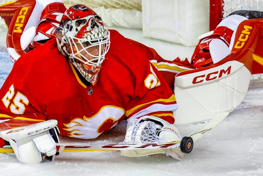 Calgary Flames goaltender Jacob Markstrom makes a save against the Carolina Hurricanes at Scotiabank Saddledome in Calgary on Saturday, Oct. 22, 2022.