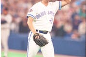  Jimmy Key doffs his cap to the crowd after pitching in what would be his final start as a Jay in Game 4 of the 1992 World Series. Key signed with the New York Yankees the following season. FRED THORNHILL/SUN FILES