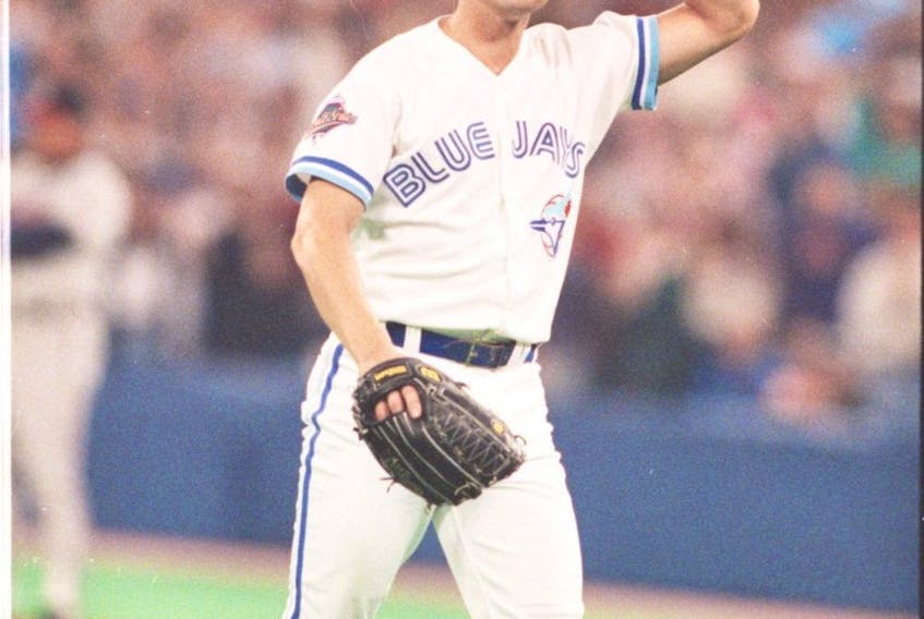  Jimmy Key doffs his cap to the crowd after pitching in what would be his final start as a Jay in Game 4 of the 1992 World Series. Key signed with the New York Yankees the following season. FRED THORNHILL/SUN FILES