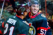  Senators centre Shane Pinto celebrates with teammate Mathieu Joseph after scoring a goal against the Coyotes in the first period of Saturday’s game.