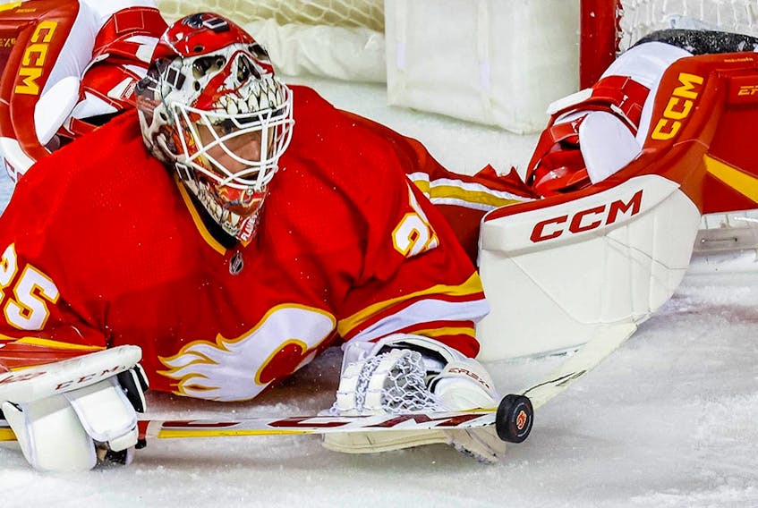 Calgary Flames goalie Jacob Markstrom makes a save against the Carolina Hurricanes during NHL hockey action at the Scotiabank Saddledome in Calgary on Saturday, October 22, 2022. 