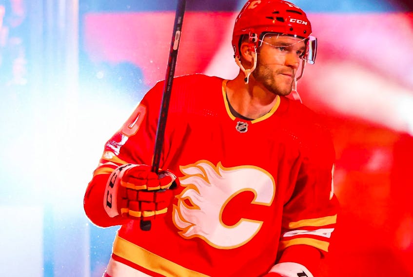 Oct 13, 2022; Calgary, Alberta, CAN; Calgary Flames center Jonathan Huberdeau (10) during player introduction prior to the game between the Calgary Flames and the Colorado Avalanche at Scotiabank Saddledome.  
