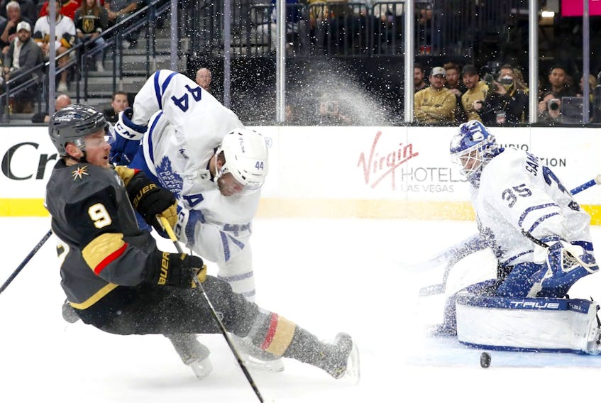 Toronto Maple Leafs goaltender Ilya Samsonov (35) blocks a shot on goal by Vegas Golden Knights center Jack Eichel (9) as Maple Leafs' Morgan Rielly (44) defends during the second period in Las Vegas on Monday night. 
