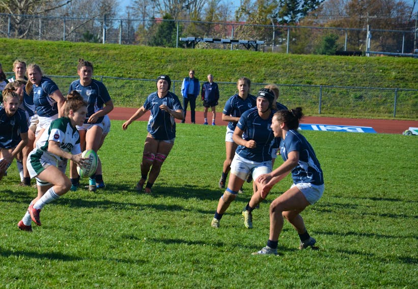 The UPEI Panthers’ Mia Fradsham, from Charlottetown, looks to manoeuvre around St. Francis Xavier X-Women defenders during the Atlantic University Sport (AUS) women’s rugby semifinal game at MacAdam Field in Charlottetown on Oct. 19. The Panthers, who won the semifinal game 14-12, visit the Acadia Axewomen in the conference championship game on Oct. 26. Jason Simmonds • The Guardian