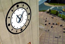 ALL ALONG THE CLOCK TOWER People near the MUN student centre walk past the Memorial University clock tower Tuesday afternoon. KEITH GOSSE/THE TELEGRAM