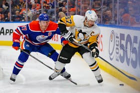 Oct 24, 2022; Edmonton, Alberta, CAN; Edmonton Oilers forward Connor McDavid (97) and Pittsburgh Penguins forward Sidney Crosby (87) battle along the boards for a loose puck during the second period at Rogers Place. Mandatory Credit: Perry Nelson-USA TODAY Sports  Edmonton Oilers forward Connor McDavid (97) and Pittsburgh Penguins forward Sidney Crosby (87) battle along the boards for a loose puck during the second period at Rogers Place on Monday. - Perry Nelson-USA TODAY Sports