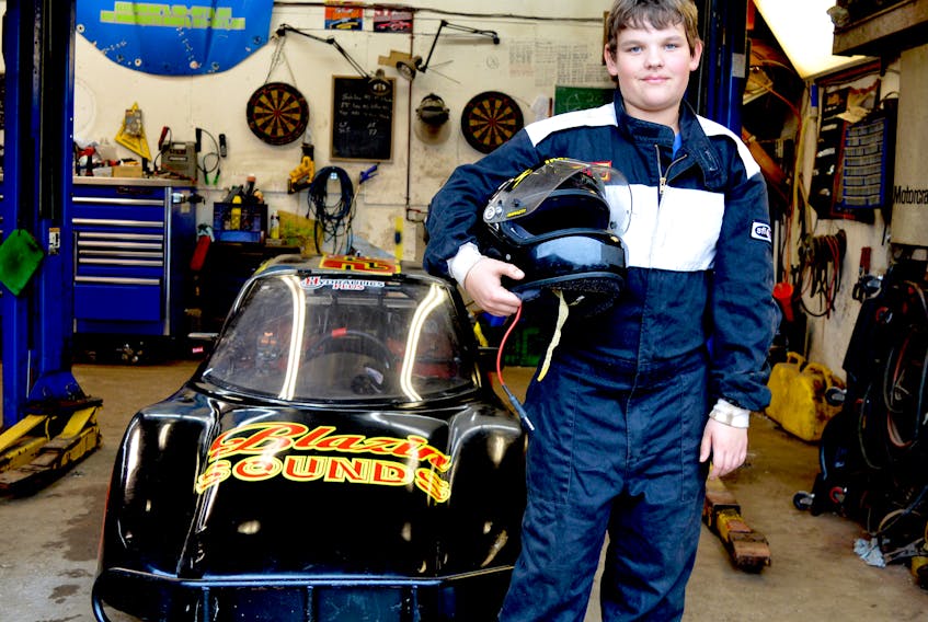 Brett Biron stands in front of his Bandolero car at his home in Sydney. The 13-year-old middle school student might not be able to legally drive a normal car, but he competes in a vehicle that can reach speeds in excess of 110 kilometres an hour. Chris Connors/Cape Breton Post