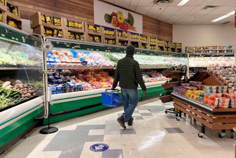 FILE PHOTO: A person shops at the North Mart grocery store in Iqaluit, Nunavut, Canada July 28, 2022. REUTERS/Carlos Osorio/File Photo  A person shops at the North Mart grocery store in Iqaluit, Nunavut, on July 28, 2022. REUTERS/Carlos Osorio/File Photo
