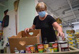 Pickup orders were being prepared by Joanne MacNeil and others at the North Sydney Food Bank on Thursday. Rising grocery prices have led to new users of the food bank, including more seniors. GREG MCNEIL/CAPE BRETON POST
