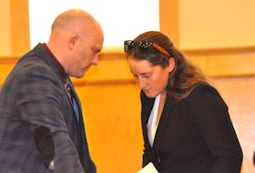 Robby Ash, left, talks with his client, Noelle Laite, on day two of the RNC officer’s trial in provincial court in Corner Brook on Friday, Oct. 28. Laite is charged with assaulting her former intimate partner. - Diane Crocker/SaltWire Network