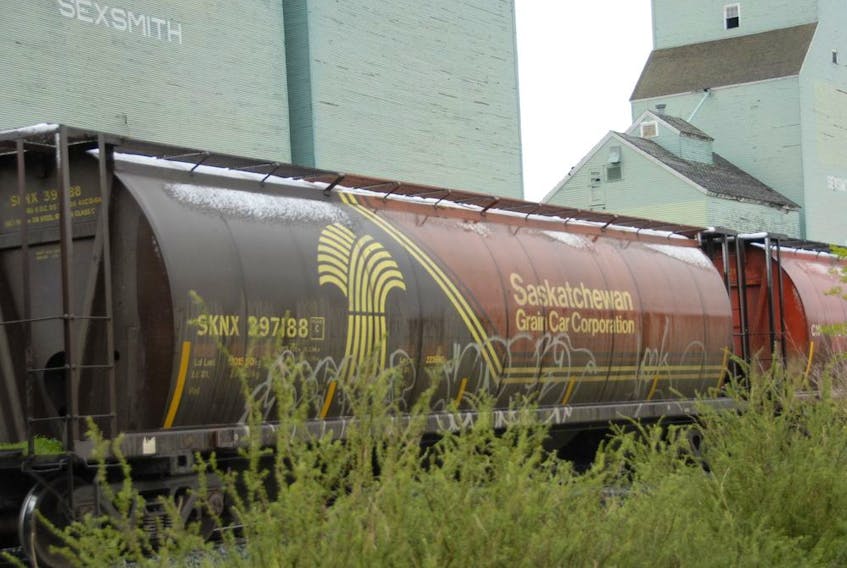  A train passes by the Sexsmith grain elevator in Alberta, in 2011.