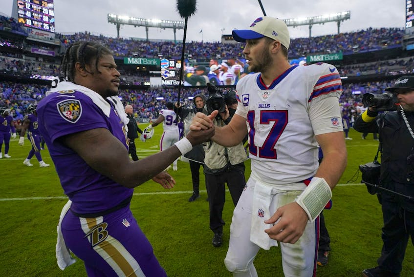 Baltimore Ravens quarterback Lamar Jackson (left) and Buffalo Bills quarterback Josh Allen shake hands after Sunday's game.