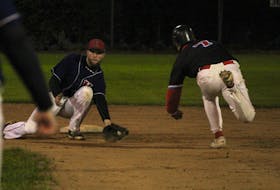 Kentville Wildcats shortstop Codey Shrider, left, prepares to tag out Ryan Sanderson, of the Halifax Pelham Canadians, trying to steal second Oct. 2 during Game 2 of the Nova Scotia Senior Baseball League final in Kentville.
Jason Malloy