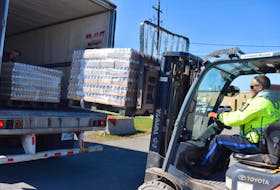Const. Ken Macdonald helped unload a delivery of Labatt water that was donated to help people in Pictou County impacted by Fiona.
