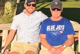Patrick Rutherford (left) and his father Bill Rutherford following a recent golf outing. Contributed