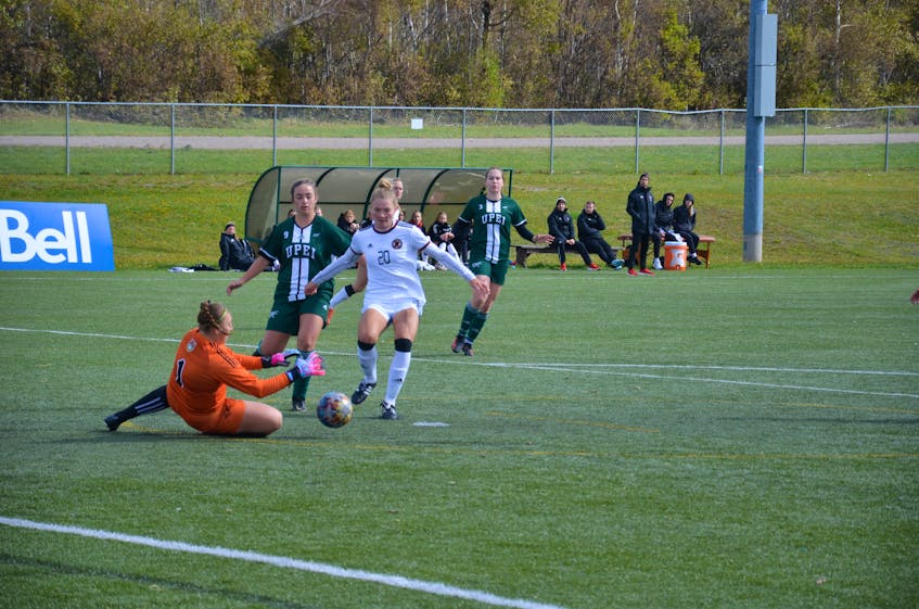 UPEI Panthers keeper Veronica Kozak makes a save as the UNB Reds’ Aurora Hughes-Goyette, 20, looks for a rebound. Also following the player are the Panthers’ Mia Martell, 9, and Roselyn Kushko, 3. The teams played to a scoreless draw. Jason Simmonds • The Guardian