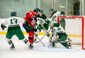 UPEI Panthers goaltender Jonah Capriotti makes a save as the Acadia Axemen’s Corson Hopwo, 10, looks for a rebound during an Atlantic University Sport men’s hockey game at MacLauchlan Arena on the UPEI campus Oct. 29. The Panthers won the game 3-0. Janessa Hogan • UPEI Athletics
