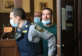 Adam Joseph Drake is led out of Halifax provincial court Oct. 31, 2022, after being arraigned on a charge of first-degree murder in the November 2016 shooting death of Tyler Keizer. An earlier charge of murdering Keizer was withdrawn in October 2021, right before Drake was supposed to stand trial.