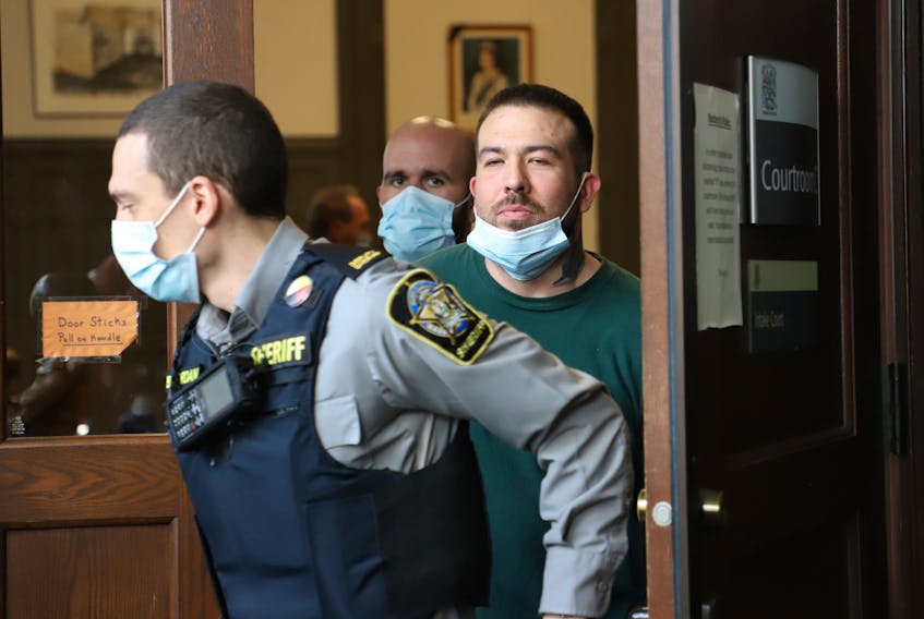 Adam Joseph Drake is led out of Halifax provincial court Oct. 31, 2022, after being arraigned on a charge of first-degree murder in the November 2016 shooting death of Tyler Keizer. An earlier charge of murdering Keizer was withdrawn in October 2021, right before Drake was supposed to stand trial.