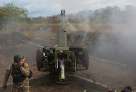 A member of the Ukrainian National Guard fires a D-30 howitzer towards Russian troops, amid Russia's attack on Ukraine, in Kharkiv region, Ukraine October 5, 2022. REUTERS/Vyacheslav Madiyevskyy  A member of the Ukrainian National Guard fires a D-30 howitzer towards Russian troops, amid Russia's attack on Ukraine, in the Kharkiv region of Ukraine on Oct. 5, 2022. REUTERS/Vyacheslav Madiyevskyy
