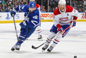Alex Steeves of the Toronto Maple Leafs skates after a puck against Joel Armia of the Montreal Canadiens during an NHL pre-season game at Scotiabank Arena on September 28, 2022 in Toronto, Ontario, Canada.  