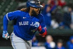 Oct 3, 2022; Baltimore, Maryland, USA; Toronto Blue Jays first baseman Vladimir Guerrero Jr. (27) smiles after hitting a third inning solo home run against the Baltimore Orioles  at Oriole Park at Camden Yards.  