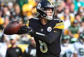 Oct 2, 2022; Pittsburgh, Pennsylvania, USA; Pittsburgh Steelers quarterback Kenny Pickett (8) looks for a receiver against the New York Jets during the fourth quarter at Acrisure Stadium. The Jets won 24-20.  