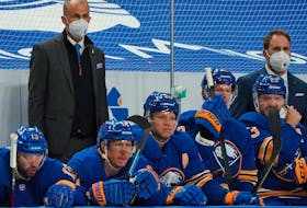 Buffalo Sabres interim head coach Don Granato (left) and assistant coach Matt Ellis behind the bench during the game against the Boston Bruins at KeyBank Center on March 18, 2021 in Buffalo, New York. 