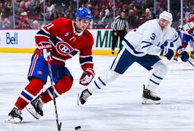 Montreal Canadiens centre Sean Monahan plays the puck agaisnt the Toronto Maple Leafs during the third period at the Bell Centre on Oct. 3 in Momtreal. 