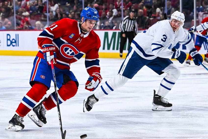 Montreal Canadiens centre Sean Monahan plays the puck agaisnt the Toronto Maple Leafs during the third period at the Bell Centre on Oct. 3 in Momtreal. 