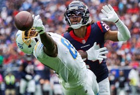 Oct 2, 2022; Houston, Texas, USA; Los Angeles Chargers wide receiver Mike Williams (81) attempts to make a catch as Houston Texans cornerback Derek Stingley Jr. (24) defends during the third quarter at NRG Stadium.  