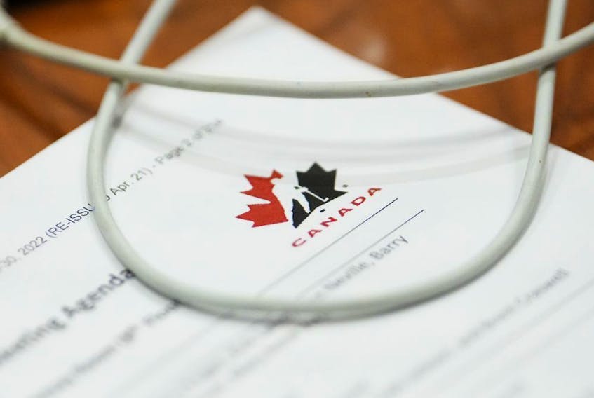 A Hockey Canada document is review by a member of Parliament during a House of Commons Committee on Canadian Heritage looking into safe sport in Canada on Parliament Hill in Ottawa on Tuesday, Oct. 4, 2022.
