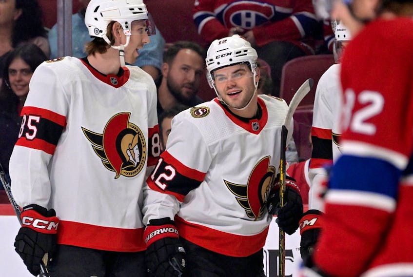Ottawa Senators forward Alex Debrincat (12) celebrates with teammates after scoring a goal against the Montreal Canadiens during the first period at the Bell Centre.