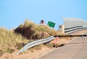 This is a section of road washed away at the bridge at Covehead Harbour. Before post-tropical storm Fiona, this was a continuous dune. Rafe Wright • The Guardian