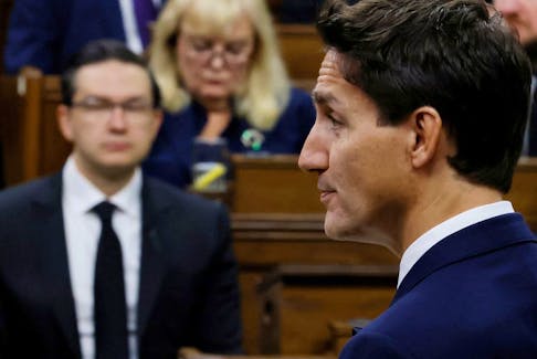 Canada's Prime Minister Justin Trudeau, watched by Conservative Party of Canada leader Pierre Poilievre, speaks in the House of Commons on Parliament Hill in Ottawa, Ontario, Canada September 15, 2022. REUTERS/Blair Gable