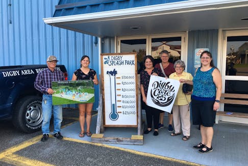 Gordie Adams (from left), Jillian MacNutt, Melissa Wallace, Lisa Burnie, Edythe Amirault and Cherie Howe pose for a photo following the Digby Care 25 cheque presentation to the  Digby Splash Park Society on Sept. 11. The thermometer has since been updated. CONTRIBUTED