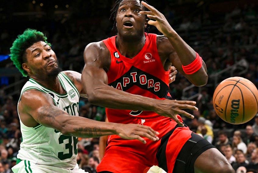 Boston Celtics guard Marcus Smart (left) blocks a shot Raptors’ OG Anunoby in Boston last night.