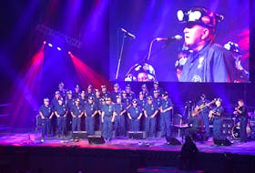 Mickey MacIntyre of New Waterford sings along with the Men of the Deeps during the grand opening of the Celtic Colours International Festival after Centre 200 in Sydney on Friday. Celtic Colours runs until Oct. 15 across Cape Breton. JEREMY FRASER/CAPE BRETON POST.