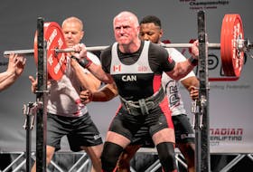 In this file photo, Ron Delaney of Sydney attempts a 391-pound squat while competing at the 2018 International Powerlifting Federation Classic World Championships in Calgary. Now 70-years-old, Delaney will attend the 2022 International Powerlifting Federation championships in St. John’s, N.L., beginning today. PHOTO CONTRIBUTED.