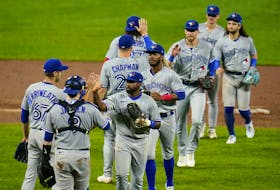 Blue Jays players celebrate a doubleheader sweep against the Orioles in Baltimore early last month. The Blue Jays head into the wild-card series having won 22 of their past 33 games since the start of September.        
