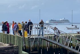Passengers disembark from the cruise ship Insignia tender at the Town of Shelburne wharf on historic Dock Street where they were welcomed with open arms by the community. KATHY JOHNSON