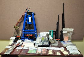 RCMP arrested a man and woman after seizing drugs, weapons and illegal items during a search at an Ardoise home on Oct. 5. Contributed