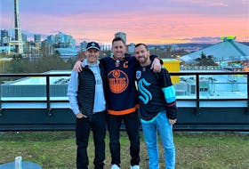 With Seattle’s famous Space Needle restaurant in the background, pictured are Mathew Rutherford (left), Matthew Shipley and Patrick Rutherford. Contributed