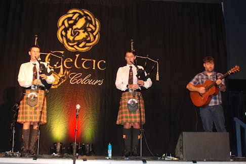 Aidan and Cameron MacNeil, accompanied by guitarist Ross Martin of Dàimh, perform during an appearance at the Gaelic College in St. Anns on Saturday. IAN NATHANSON/CAPE BRETON POST